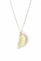  Lemon quartz charm carved to resemble a lemon slice, with 14k gold ring. A zesty, joyful gem handmade in Ojai.