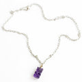 Genuine gemstone gummy bear charms in amethyst, rose quartz, phrenite, crystal quartz, and cognac quartz with 14k gold bales by Sonya Ooten.