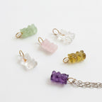 Genuine gemstone gummy bear charms in amethyst, rose quartz, phrenite, crystal quartz, and cognac quartz with 14k gold bales by Sonya Ooten.
