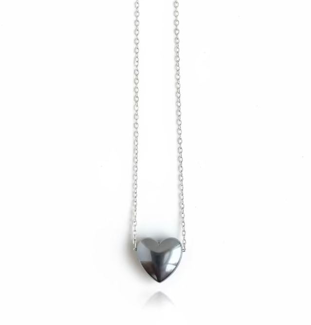 "Polished hematite heart pendant on a sterling silver chain, handcrafted by Sonya Ooten Jewelry."