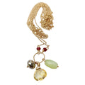Gold necklace with gemstone pendants on a white background