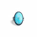 Oval Turquoise Ring with Fancy Bezel