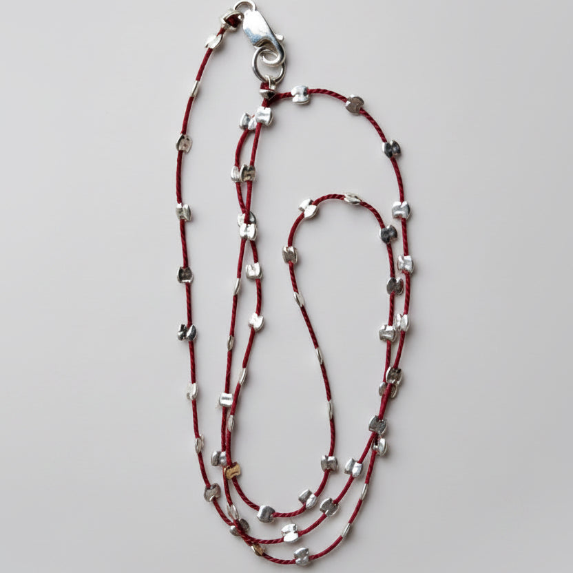 sprinkle-necklace-gold-silver-beaded-silk-cord-minimalist-jewelry.webp