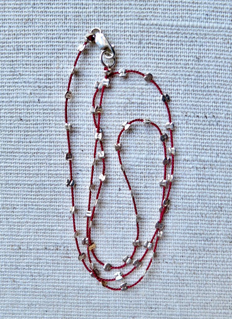 sprinkle-necklace-gold-silver-beaded-silk-cord-minimalist-jewelry.webp
