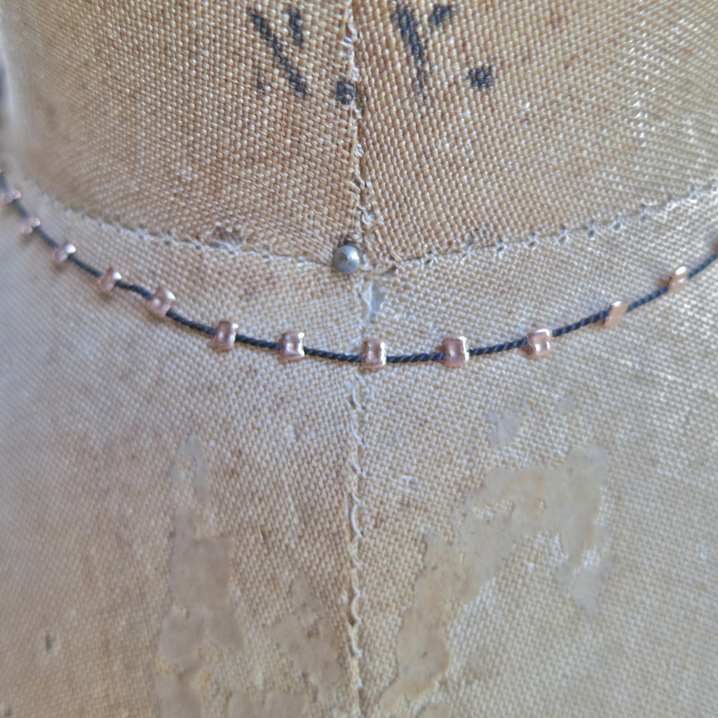 sprinkle-necklace-gold-silver-beaded-silk-cord-minimalist-jewelry.webp