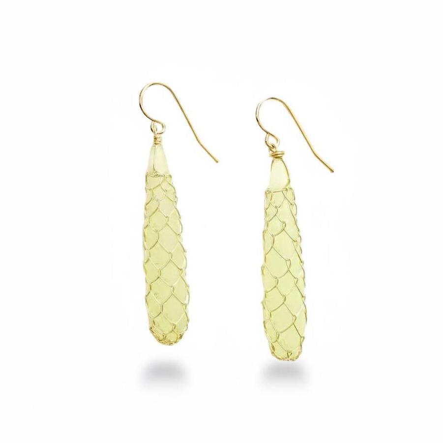Yellow gemstone earrings with textured design on a white background